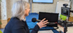 A video podcast being recorded in a clients boardroom. Media2u offers audio and video podcasting services on location or in a studio.